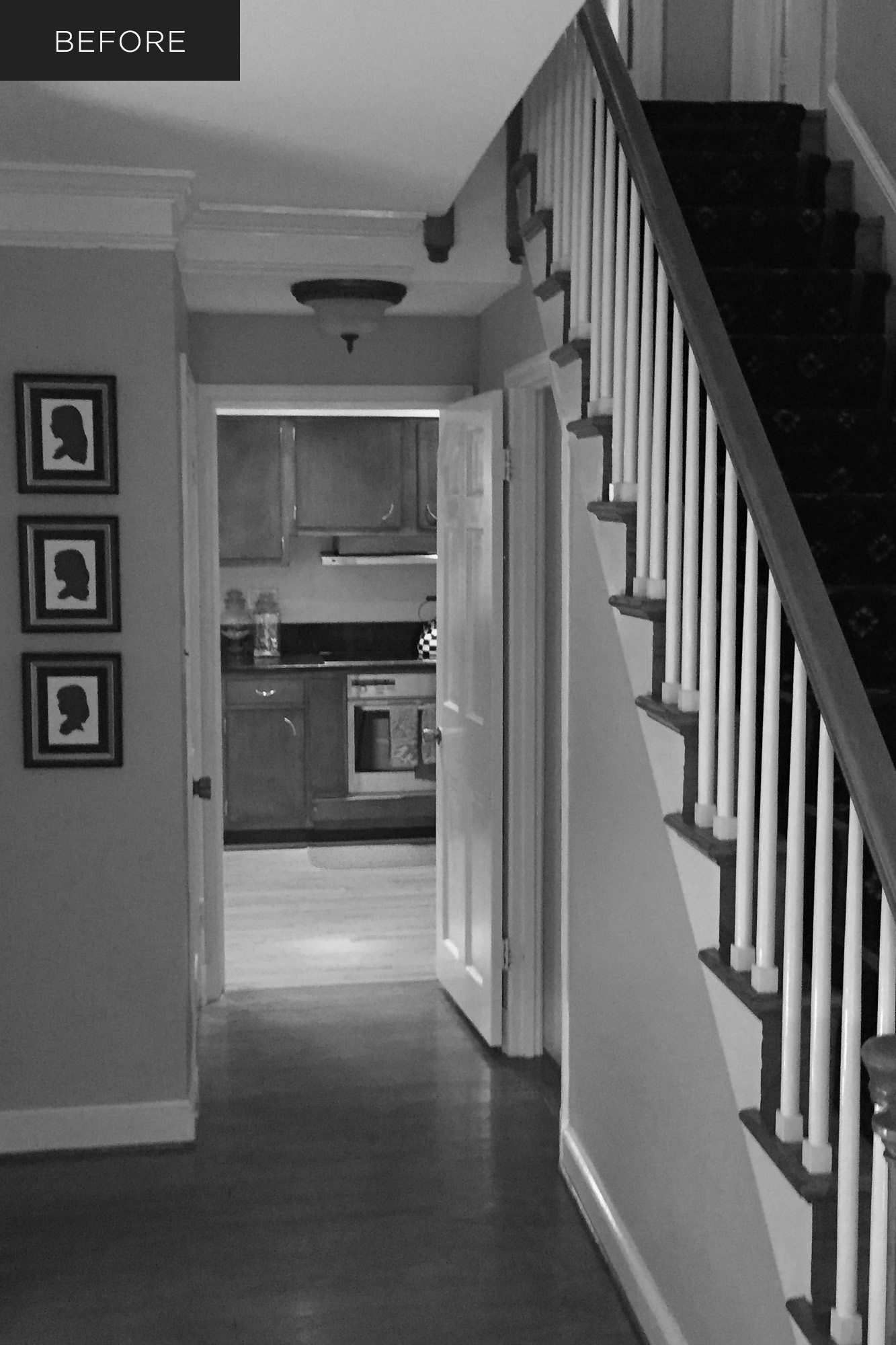 Dark front hall and kitchen before custom home renovation