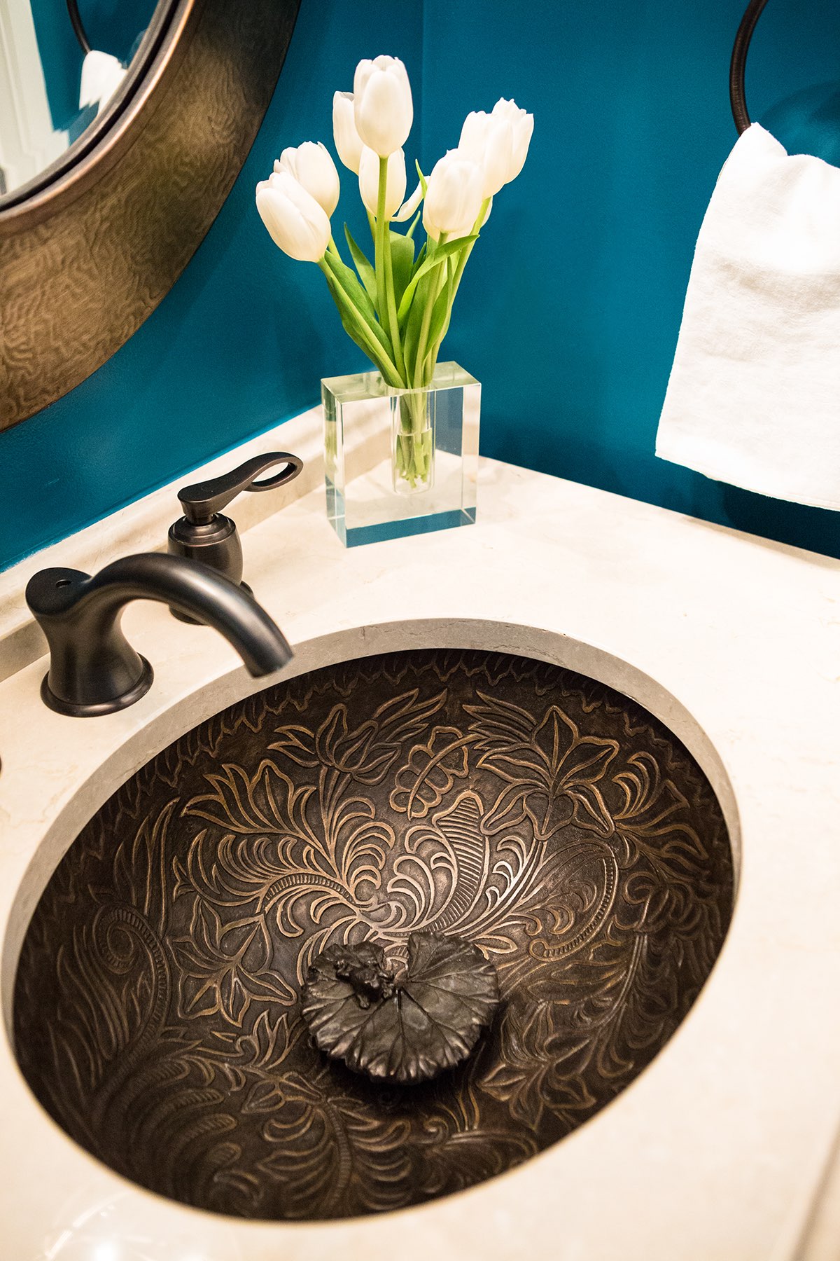 Bronze powder-room sink with lily design and lily pad sink stopper with unique tiny frog sculpture