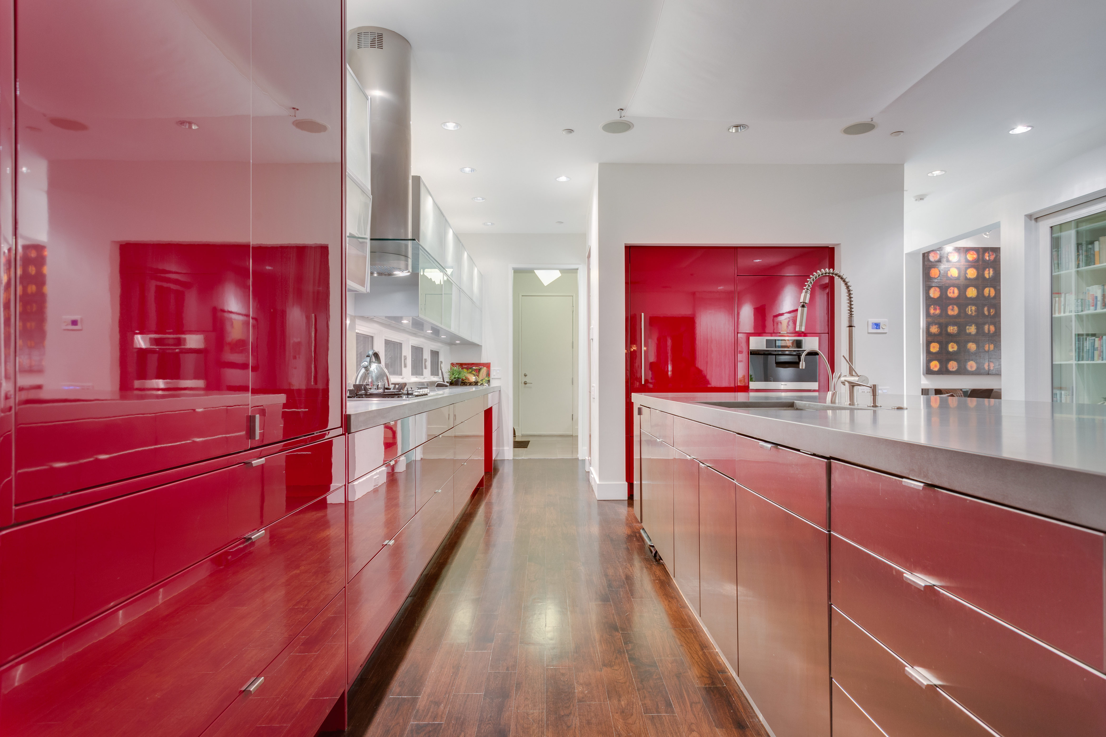 red lacquered cabinets pop in a modern kitchen