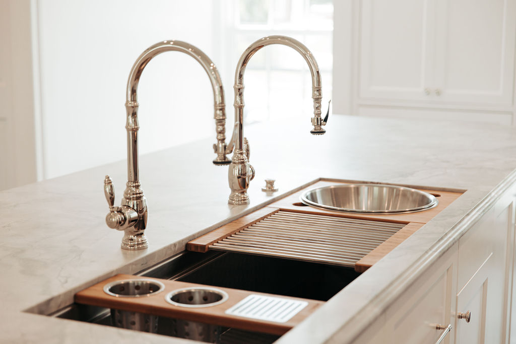 Kitchen workstation sink with double faucets